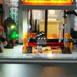 Lit street scene with clapperboard