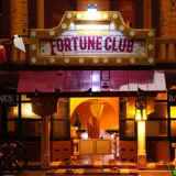 Lit 'Fortune Club' marquee.