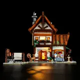 Medieval Tailor Shop glowing at night.