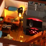 Upper floor, illuminated forge and workbench.