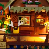 Lit cabin facade.