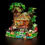 Lit jungle treehouse at night.