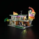 Twilight Motel illuminated at dusk.
