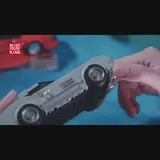 Hand holding car model.