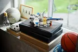 LEGO X-Wing displayed on windowsill.